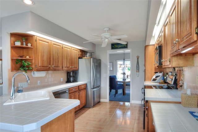 4116 4th Ave NE, Bradenton, FL 34208 - kitchen featuring ceiling fan, tile countertops, appliances with stainless steel finishes, open shelves, and a sink