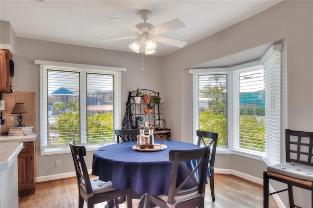 4116 4th Ave NE, Bradenton, FL 34208 - dining room with baseboards, ceiling fan, and light wood finished floors