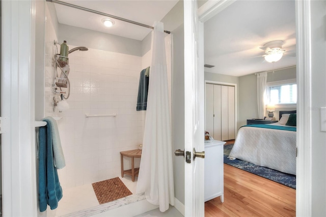 4116 4th Ave NE, Bradenton, FL 34208 - ensuite bathroom with visible vents, connected bathroom, wood finished floors, and a tile shower
