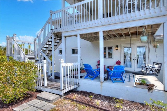 4116 4th Ave NE, Bradenton, FL 34208 - exterior space featuring french doors, stairs, and a wooden deck