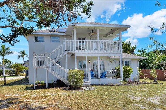 4116 4th Ave NE, Bradenton, FL 34208 - rear view of property with a lawn, fence, and a ceiling fan