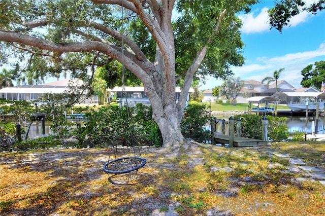 4116 4th Ave NE, Bradenton, FL 34208 - view of yard featuring a residential view, a water view, and a dock