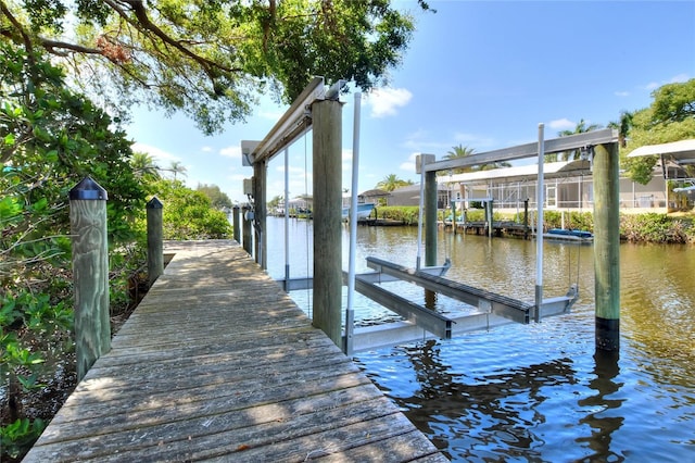 4116 4th Ave NE, Bradenton, FL 34208 - view of dock with boat lift and a water view