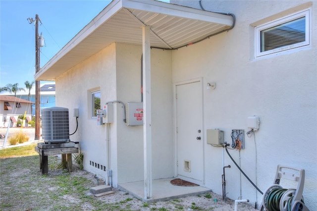 4116 4th Ave NE, Bradenton, FL 34208 - view of side of home featuring stucco siding and central AC