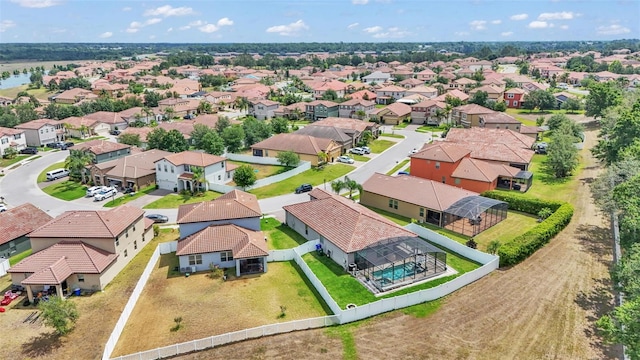 birds eye view of property with a residential view