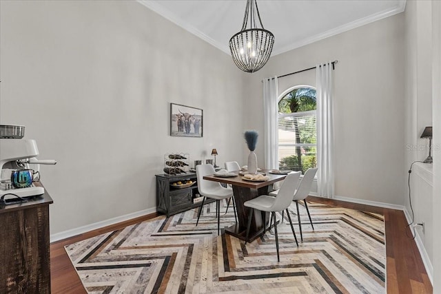 dining room featuring an inviting chandelier, ornamental molding, and baseboards