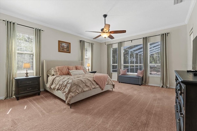 bedroom with crown molding, light carpet, and baseboards