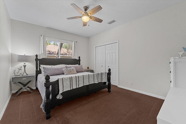 carpeted bedroom with a closet, visible vents, ceiling fan, and baseboards