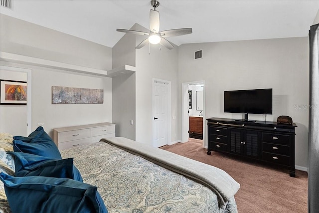 bedroom with baseboards, visible vents, carpet floors, and high vaulted ceiling