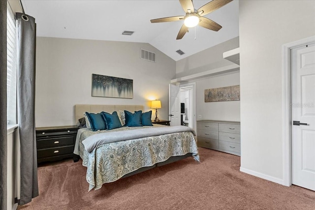 bedroom featuring visible vents, lofted ceiling, and carpet flooring