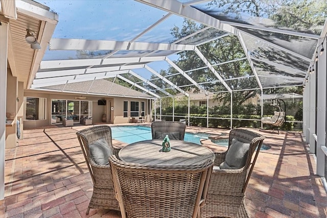 view of patio / terrace featuring outdoor lounge area and a pool with connected hot tub