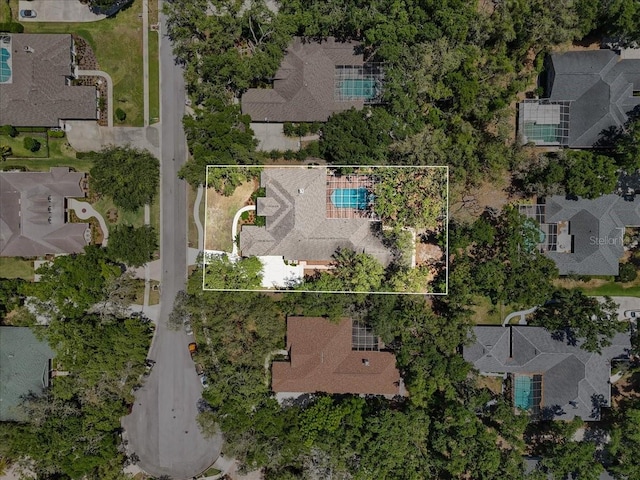 birds eye view of property with a residential view