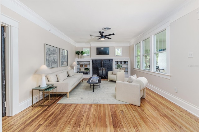 746 Mississippi Ave, Lakeland, FL 33801 - living area featuring a brick fireplace, ceiling fan, wood finished floors, and baseboards