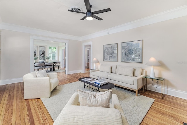 746 Mississippi Ave, Lakeland, FL 33801 - living area with wood finished floors, ceiling fan, crown molding, and baseboards