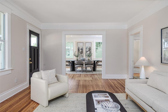 746 Mississippi Ave, Lakeland, FL 33801 - living area with baseboards, wood finished floors, and a healthy amount of sunlight