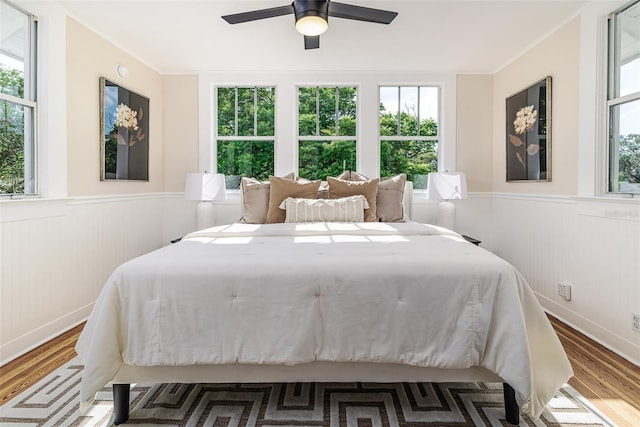 746 Mississippi Ave, Lakeland, FL 33801 - bedroom featuring crown molding, wainscoting, and wood finished floors