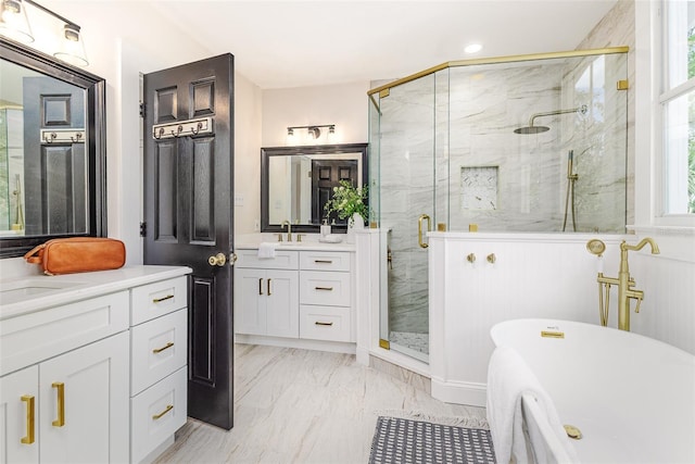 746 Mississippi Ave, Lakeland, FL 33801 - full bathroom featuring two vanities, a freestanding bath, marble finish floor, and a marble finish shower