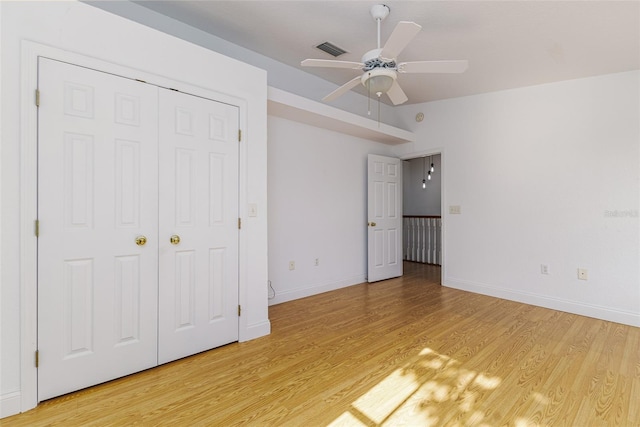 746 Mississippi Ave, Lakeland, FL 33801 - unfurnished bedroom with visible vents, ceiling fan, light wood finished floors, and baseboards