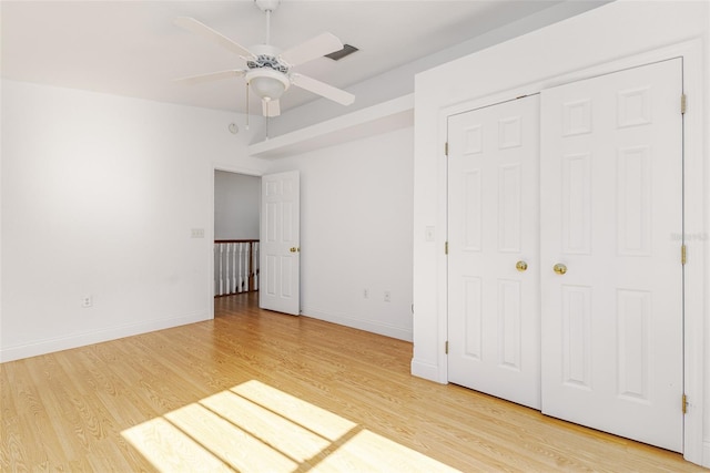 746 Mississippi Ave, Lakeland, FL 33801 - unfurnished bedroom with light wood finished floors, a ceiling fan, visible vents, and baseboards