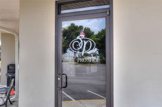 525 Eagle Run, Lakeland, FL 33809 - doorway to property with stucco siding