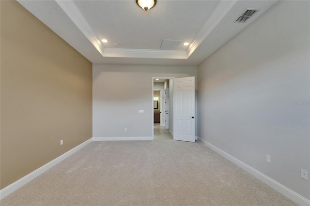 1295 Osprey Landing Dr, Lakeland, FL 33813 - spare room with a raised ceiling, crown molding, visible vents, light carpet, and baseboards