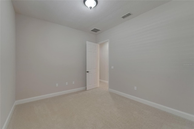 1295 Osprey Landing Dr, Lakeland, FL 33813 - spare room featuring baseboards, visible vents, and light colored carpet