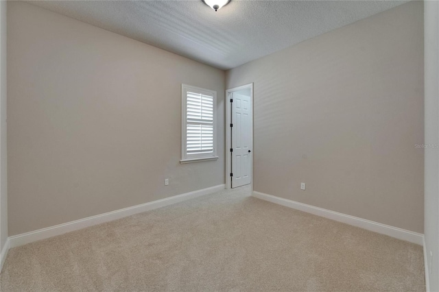 1295 Osprey Landing Dr, Lakeland, FL 33813 - empty room with a textured ceiling, light carpet, and baseboards