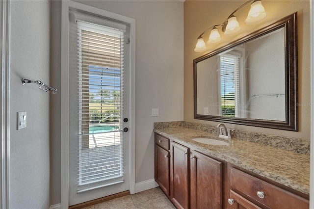 1295 Osprey Landing Dr, Lakeland, FL 33813 - bathroom with tile patterned floors, baseboards, and vanity