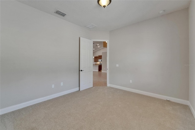 1295 Osprey Landing Dr, Lakeland, FL 33813 - spare room with light colored carpet, visible vents, and baseboards