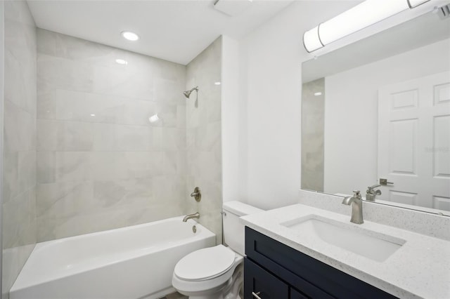 bathroom featuring shower / bathtub combination, toilet, and vanity