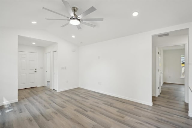 spare room with ceiling fan, recessed lighting, wood finished floors, and visible vents