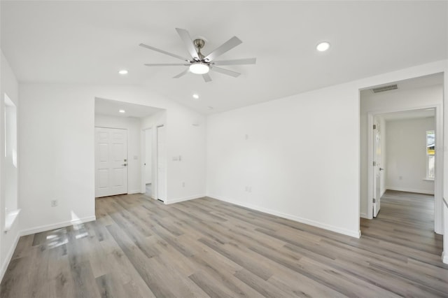 interior space featuring a ceiling fan, baseboards, recessed lighting, light wood-type flooring, and visible vents