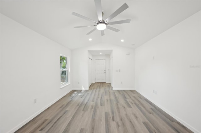 spare room with ceiling fan, light wood finished floors, recessed lighting, baseboards, and lofted ceiling