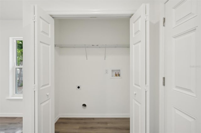 laundry area with washer hookup, hookup for an electric dryer, laundry area, wood finished floors, and baseboards