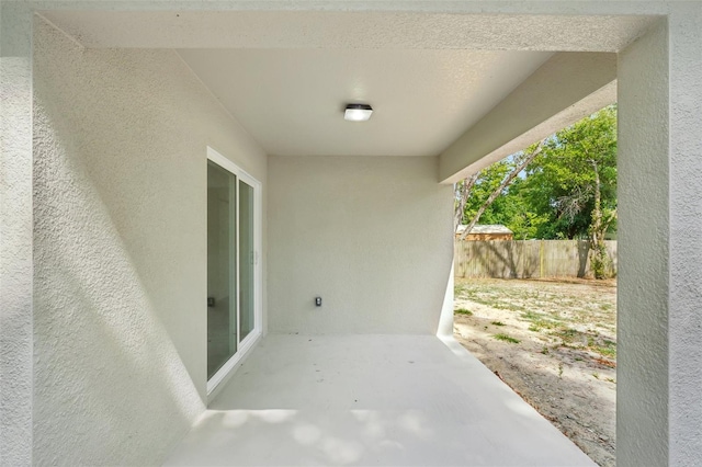 view of patio / terrace featuring fence