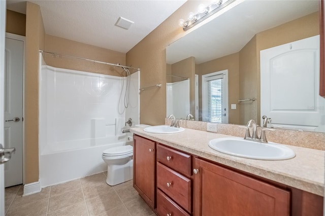 2933 Blackwater Oaks Dr, Mulberry, FL 33860 - full bathroom with toilet, double vanity, a sink, and tile patterned floors