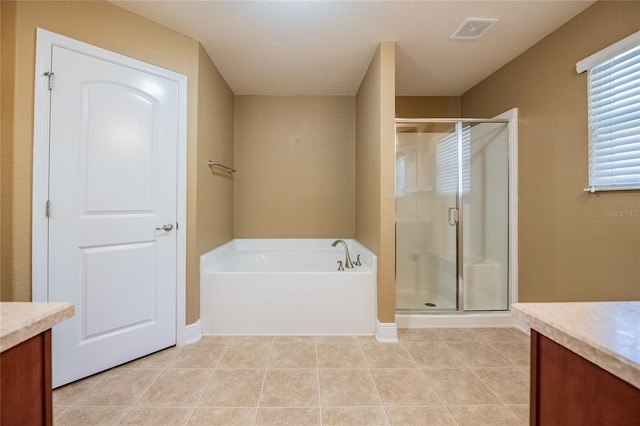 2933 Blackwater Oaks Dr, Mulberry, FL 33860 - full bathroom with visible vents, a shower stall, a bath, and vanity