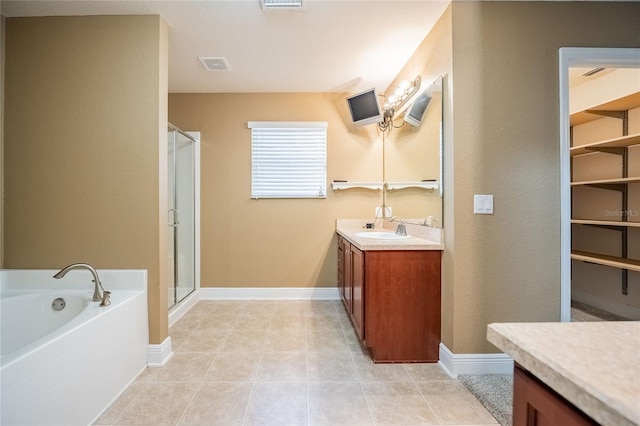 2933 Blackwater Oaks Dr, Mulberry, FL 33860 - bathroom with visible vents, vanity, a bath, and a stall shower