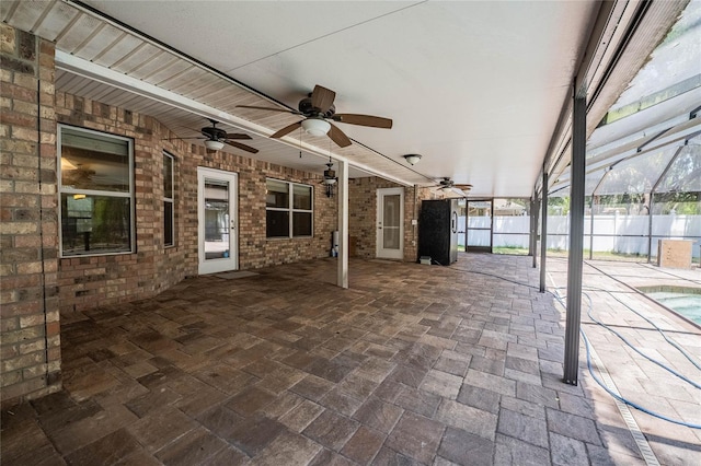 2933 Blackwater Oaks Dr, Mulberry, FL 33860 - view of patio featuring a lanai, fence, and ceiling fan