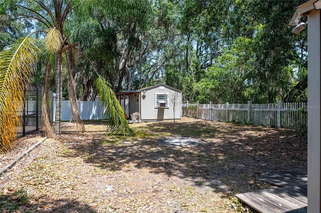 2933 Blackwater Oaks Dr, Mulberry, FL 33860 - view of yard featuring a storage unit, a fenced backyard, and an outdoor structure