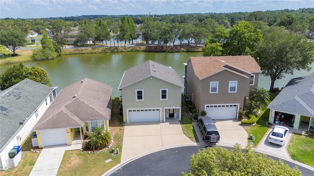 birds eye view of property with a water view and a residential view