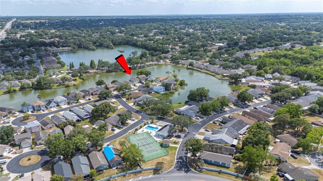 birds eye view of property featuring a residential view and a water view