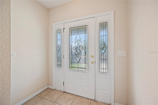 2015 Hatteras Pt, Lakeland, FL 33813 - foyer with light tile patterned floors and a textured wall