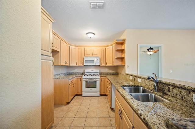 2015 Hatteras Pt, Lakeland, FL 33813 - kitchen featuring white appliances, light stone countertops, light brown cabinets, and light tile patterned flooring