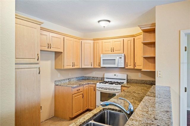 2015 Hatteras Pt, Lakeland, FL 33813 - kitchen with white appliances, light brown cabinets, open shelves, and light stone countertops