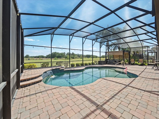 outdoor pool with a patio and glass enclosure