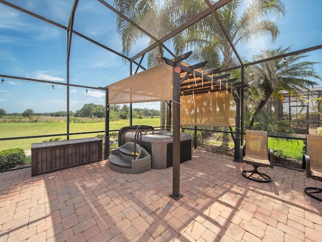 view of patio / terrace featuring a pergola, glass enclosure, and a hot tub
