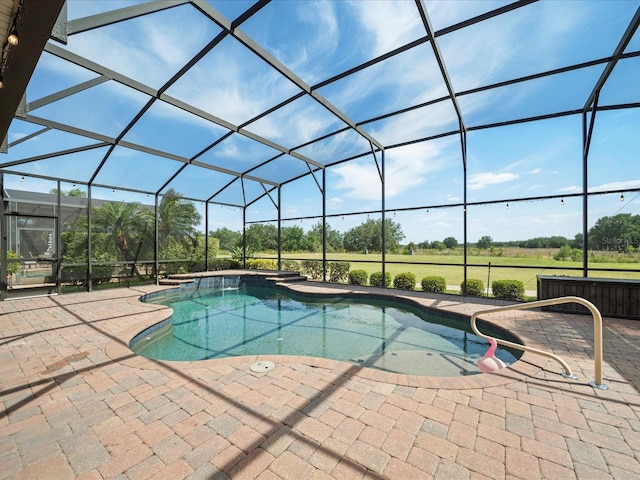 pool with a patio and a lanai