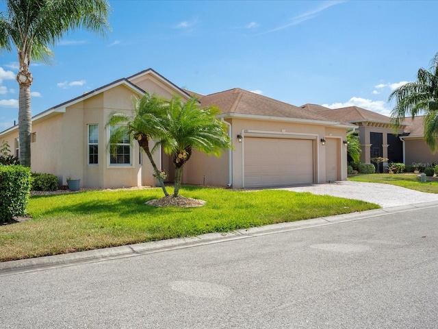 single story home with a garage, a front lawn, stucco siding, and driveway