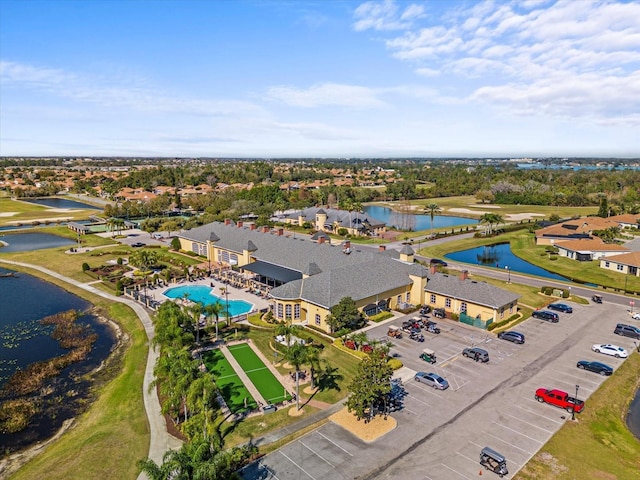 drone / aerial view with a water view and a residential view